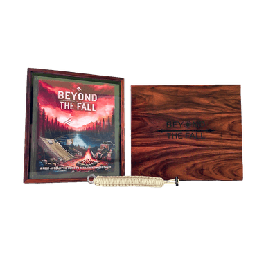 Hardcover book inside wooden collectors box, with lid to right of hardcover, with paracord bracelet laid infront of both.